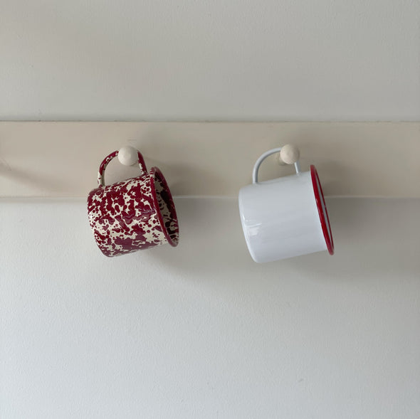 Red and White Enamelware Mugs